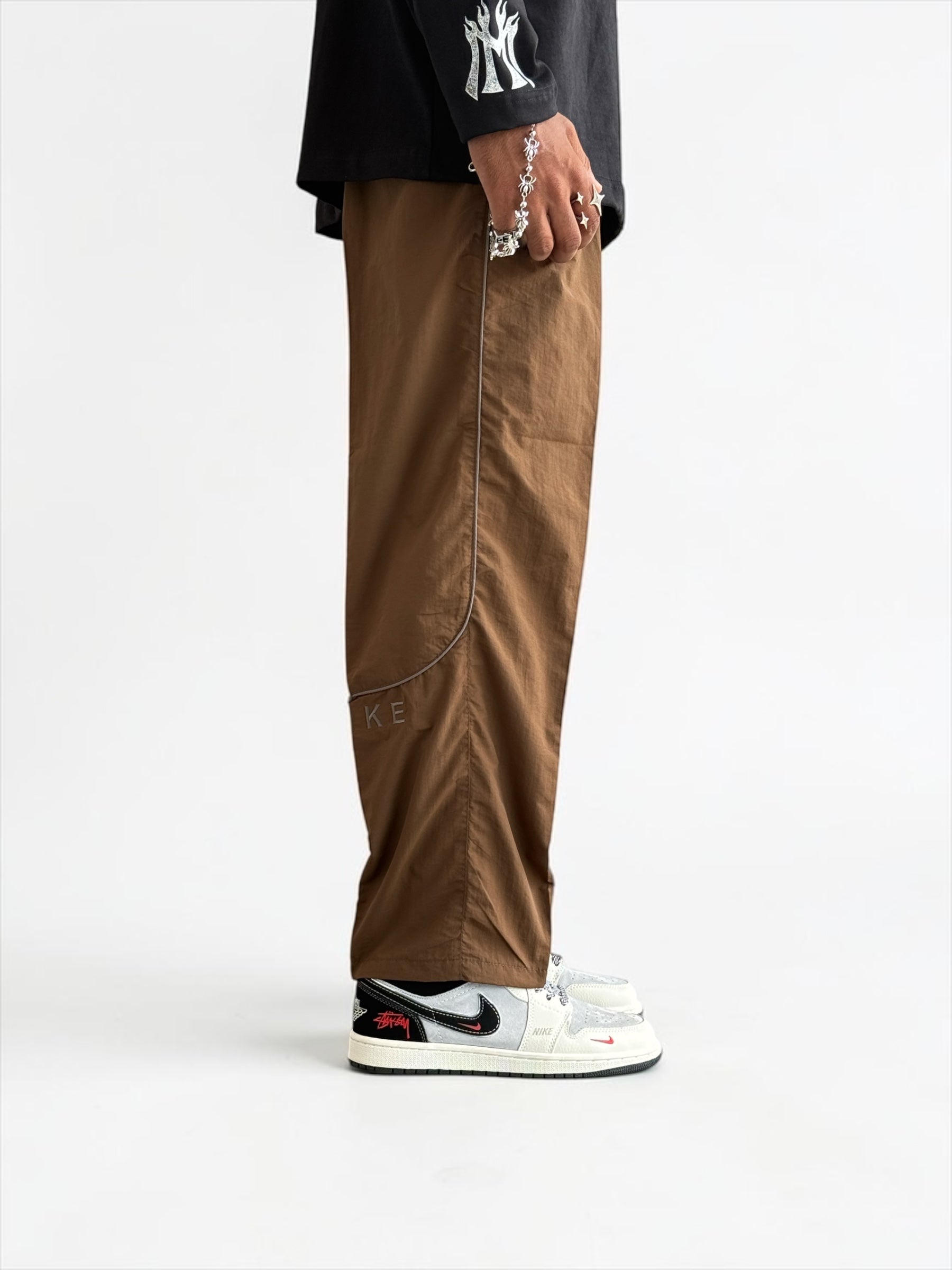 Premium straight-fit track pants for a clean, modern look. full brown